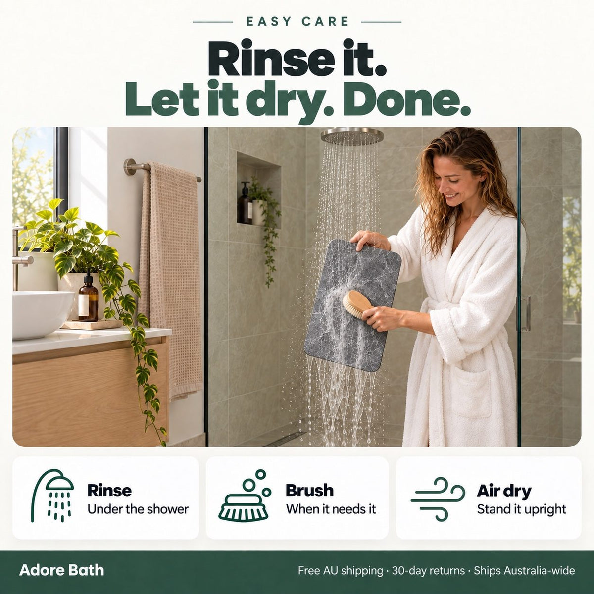 Woman in the shower rinsing the Adore Bath mat under the shower head with a soft brush