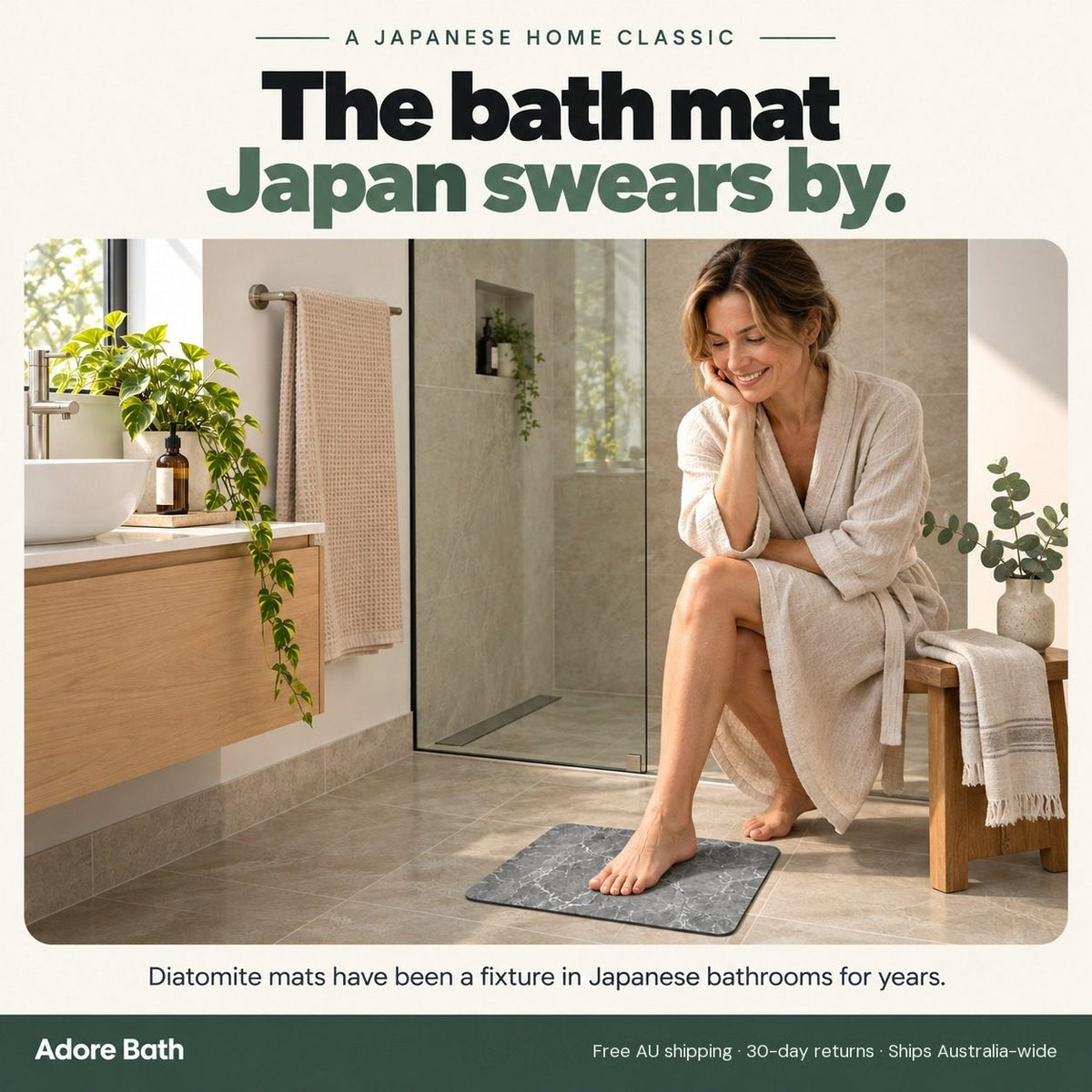 Woman in a linen robe with one foot on the diatomite bath mat